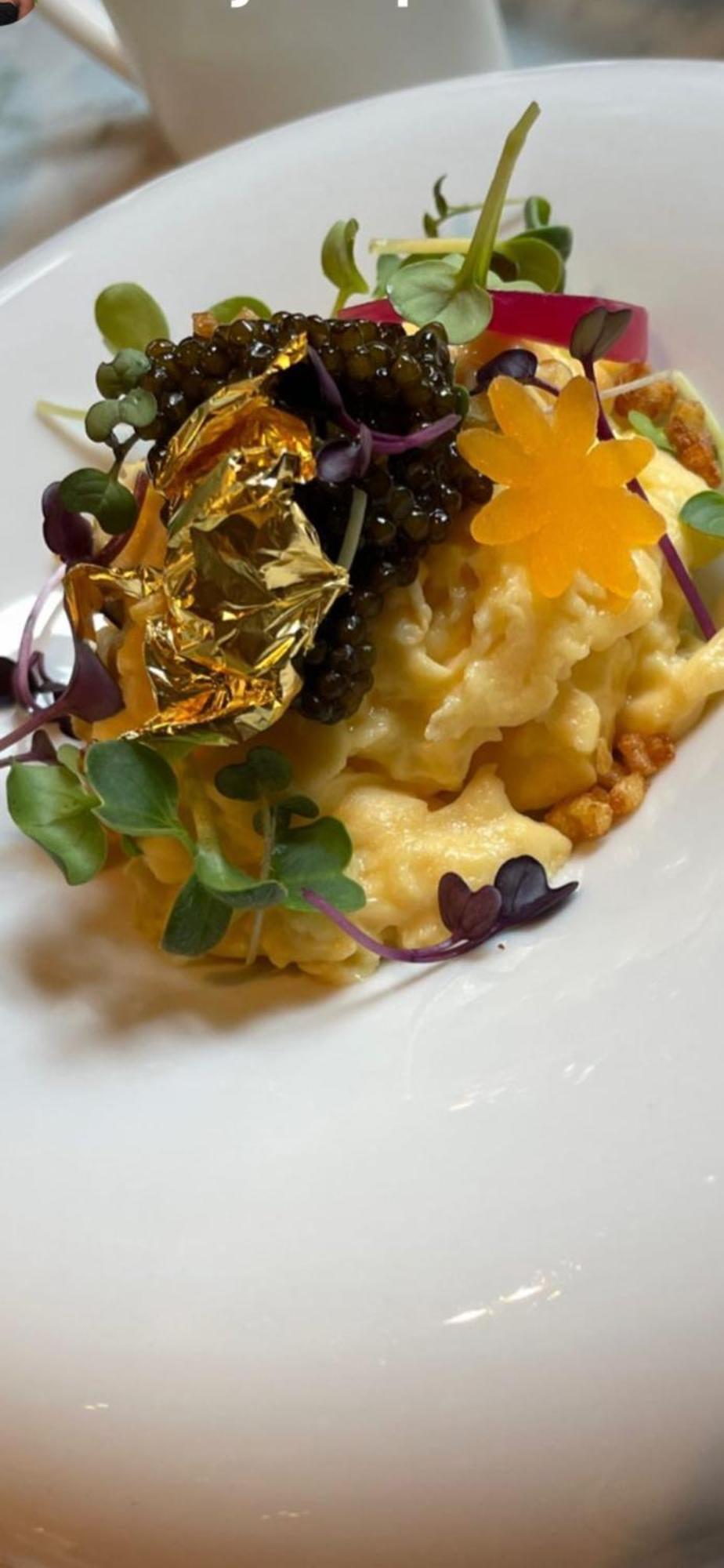 Hotel 717 암스테르담 외부 사진 A close-up of a dish of risotto with gold leaf